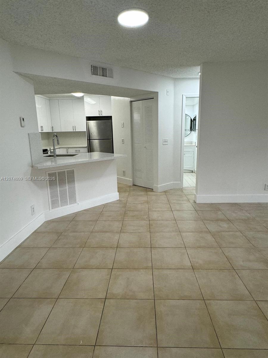 8801 Wiles Road 103 Property Photo 3