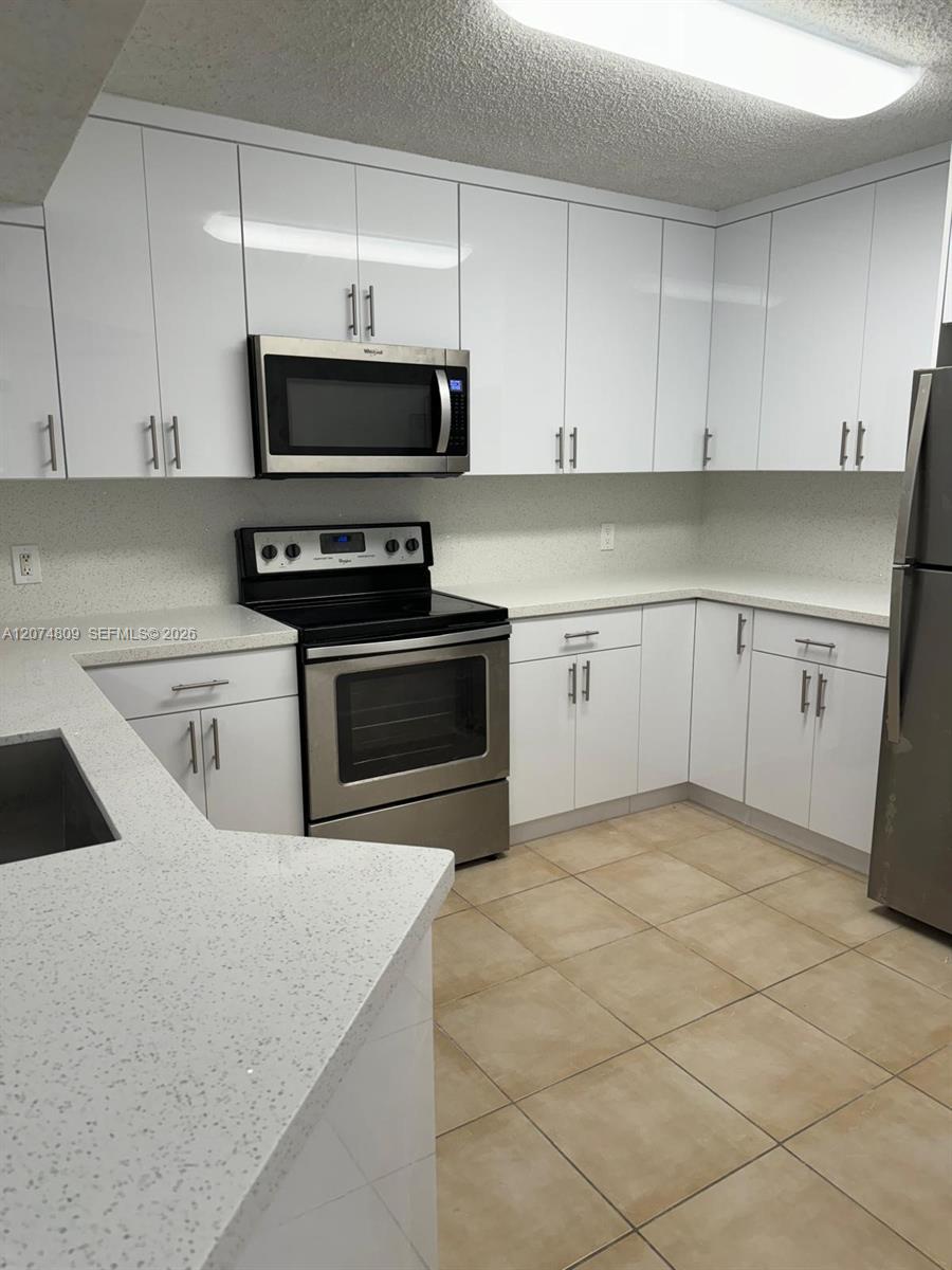 8801 Wiles Road 103 Property Photo 6