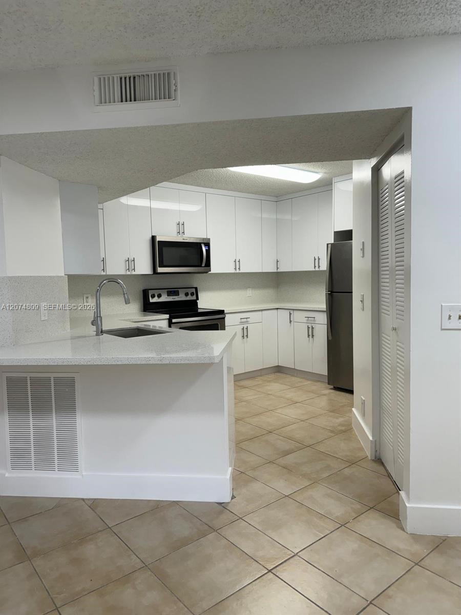 8801 Wiles Road 103 Property Photo 8