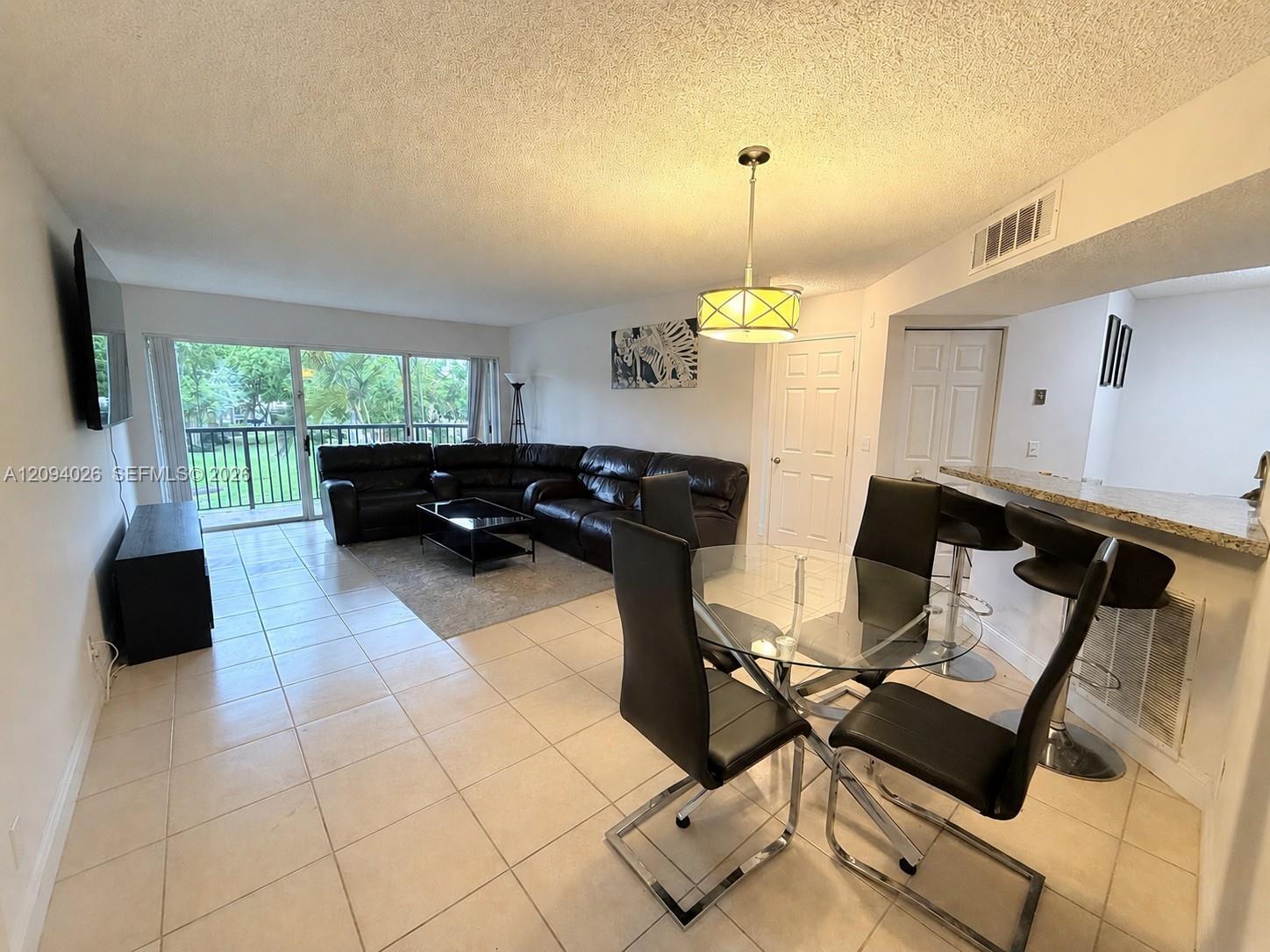 8741 Wiles Road 204 Property Photo 1