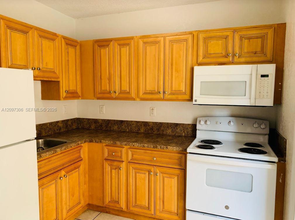 8275 NE Miami Court 102 Property Photo 1