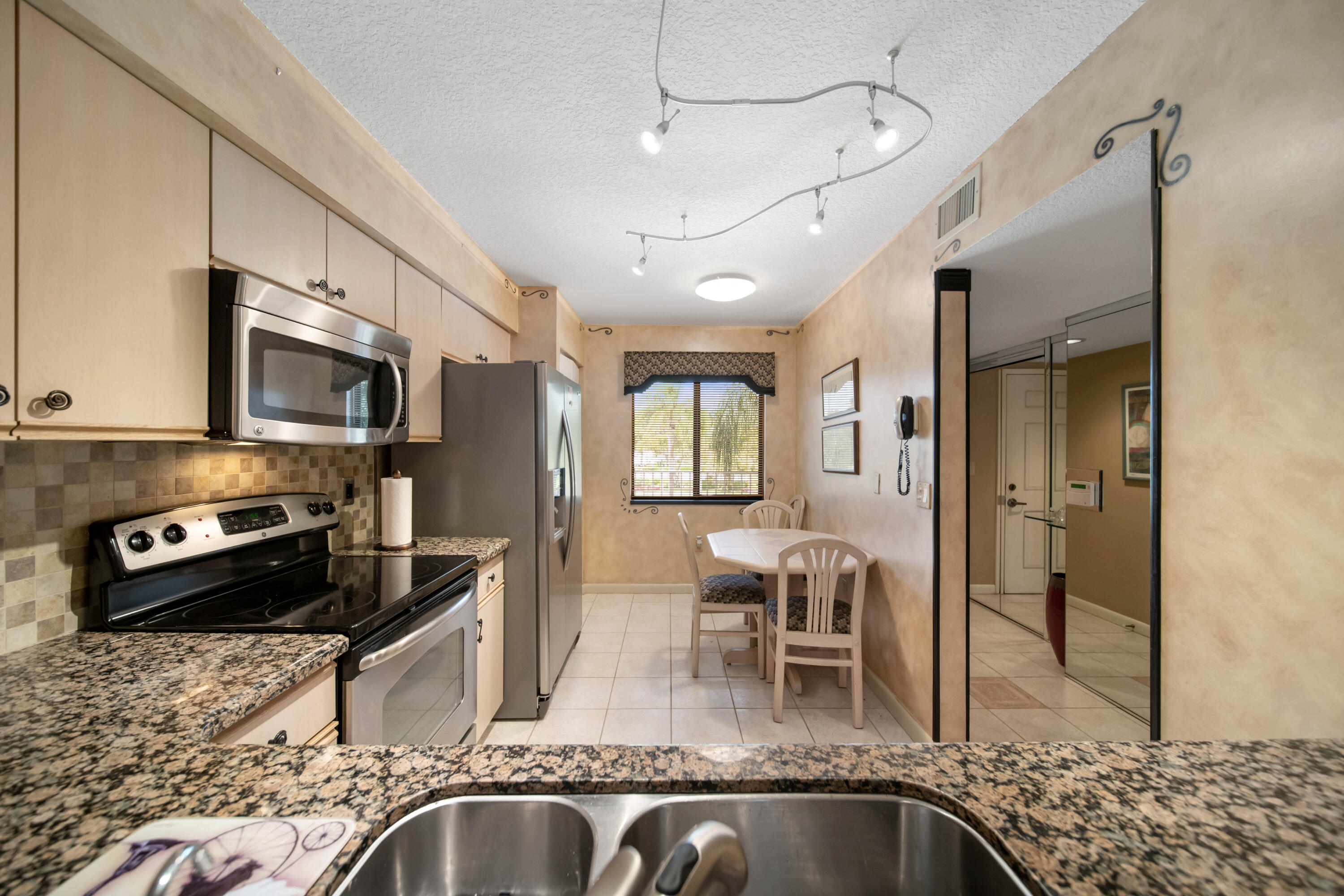 6037 POINTE REGAL Circle 307 Property Photo 1