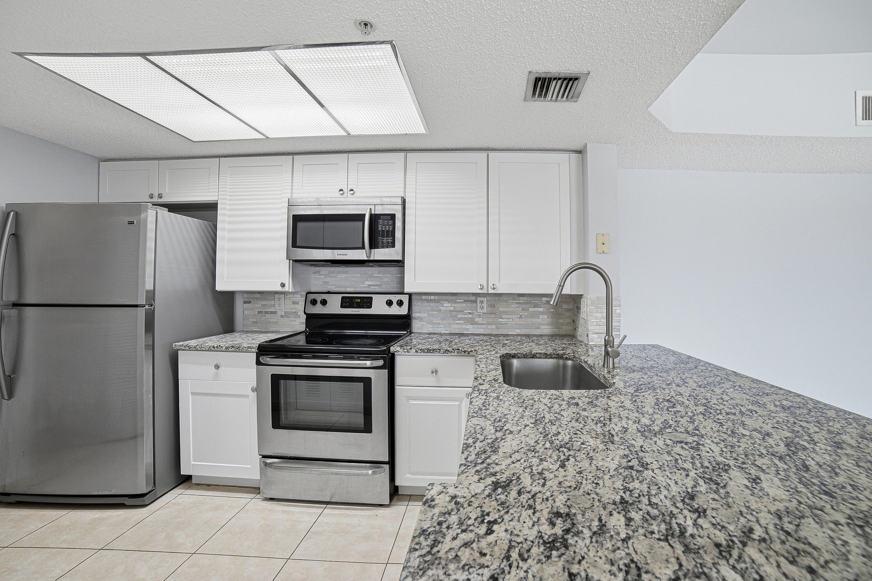 5045 WILES Road 308 Property Photo 1