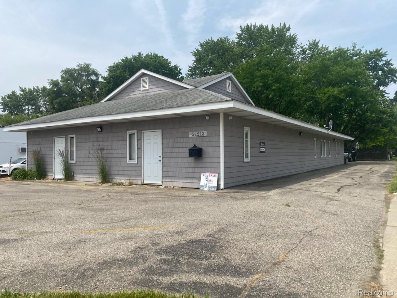 1213 N BALLENGER Highway Property Photo 1