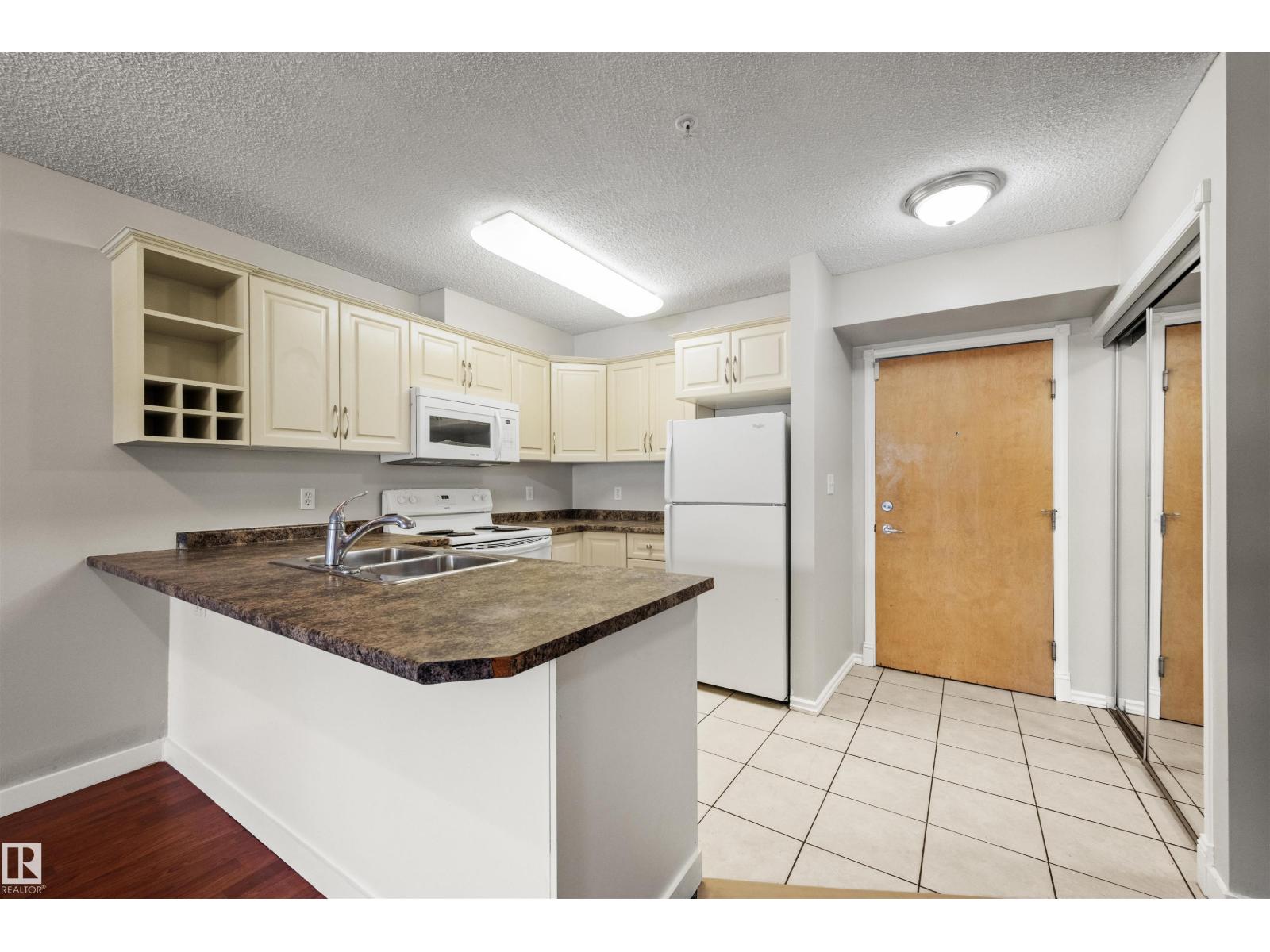 #113 17404 64 Av Nw Property Photo 1