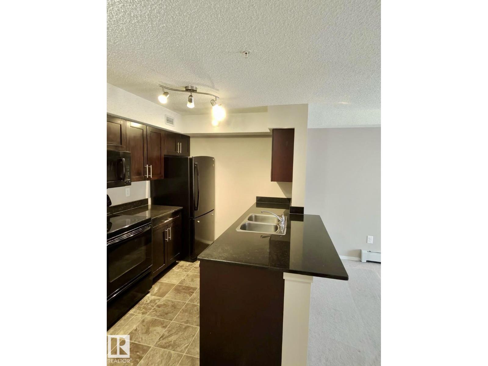 #303 1060 Mcconachie Bv Nw Property Photo 11