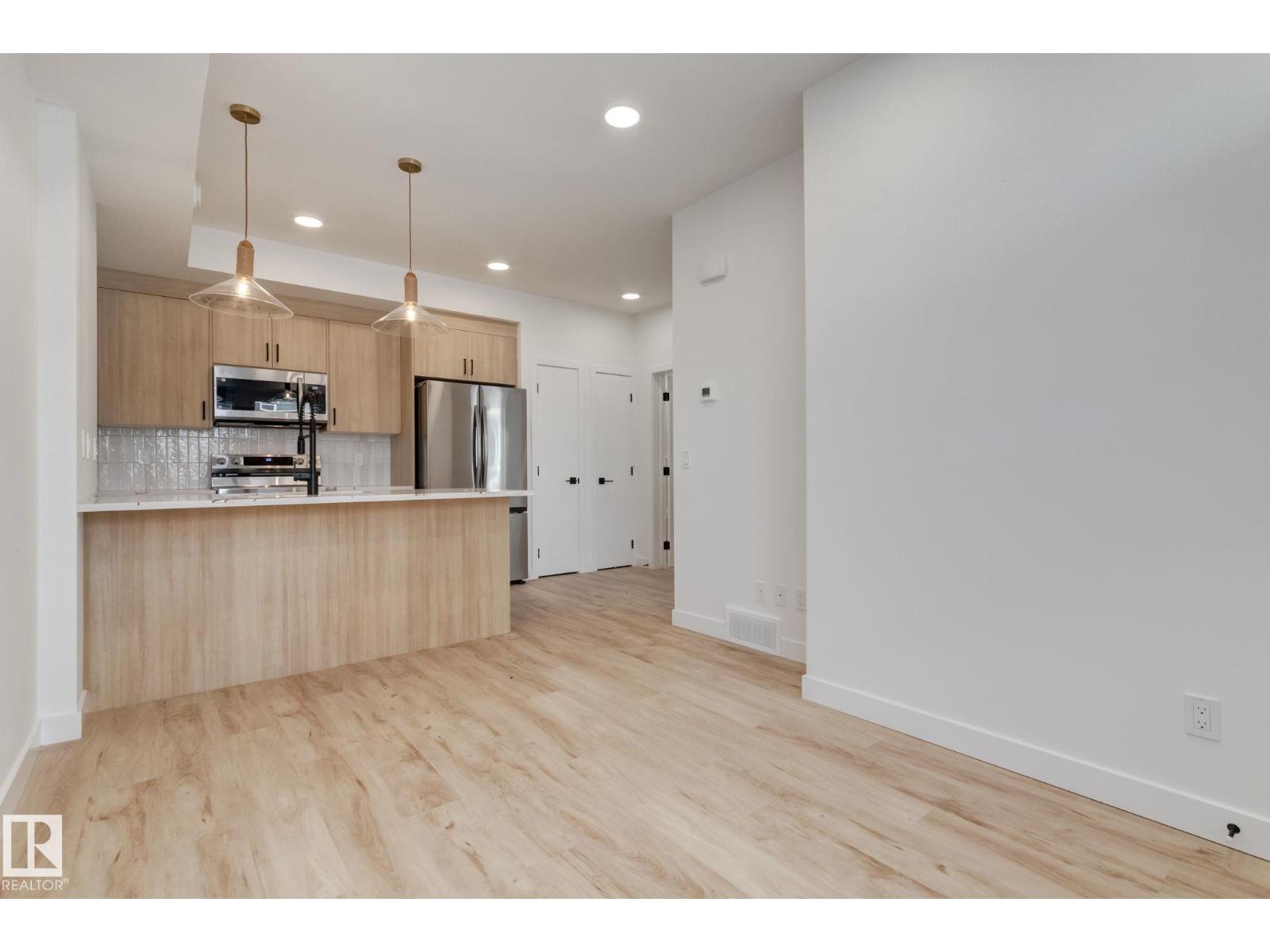 #1 16231 19 Av Sw Property Photo 3