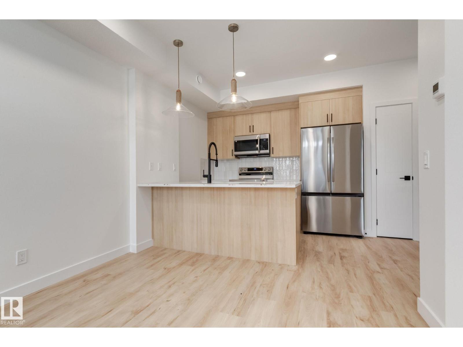#1 16231 19 Av Sw Property Photo 5