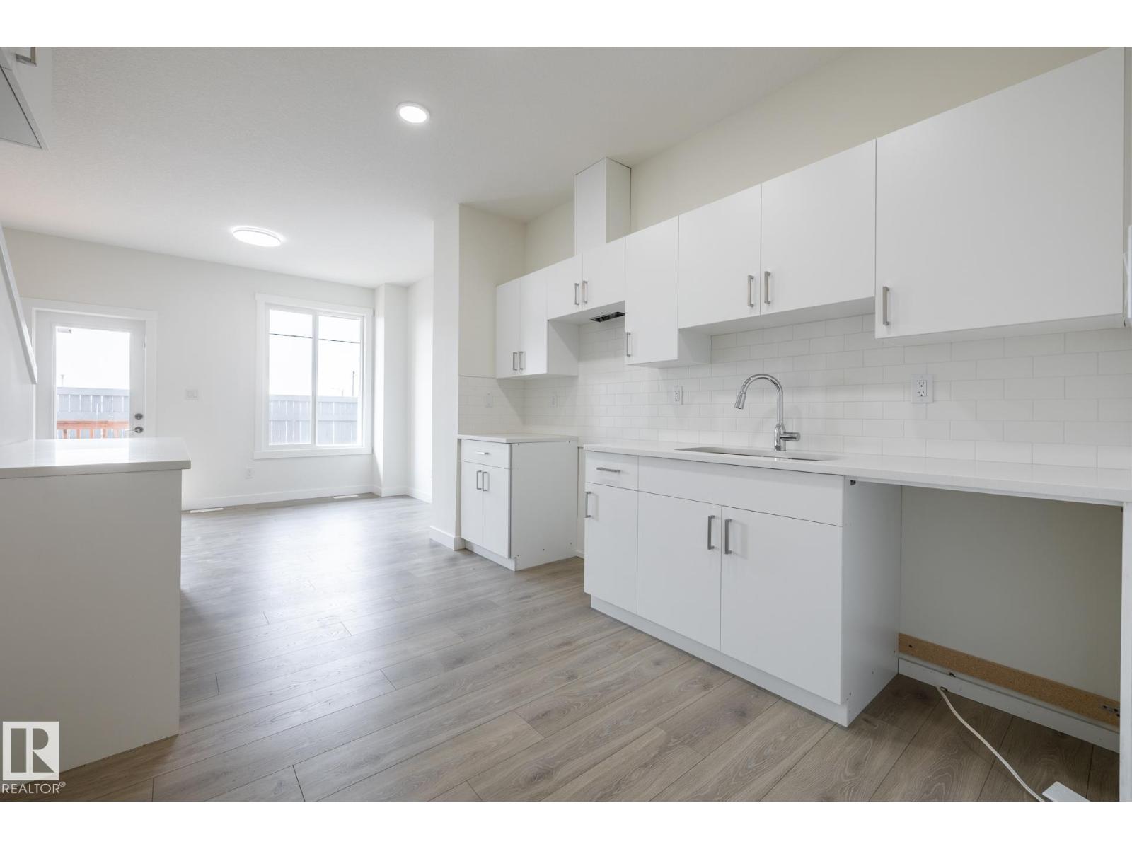 #24 7020 Keswick Cm Sw Property Photo 2