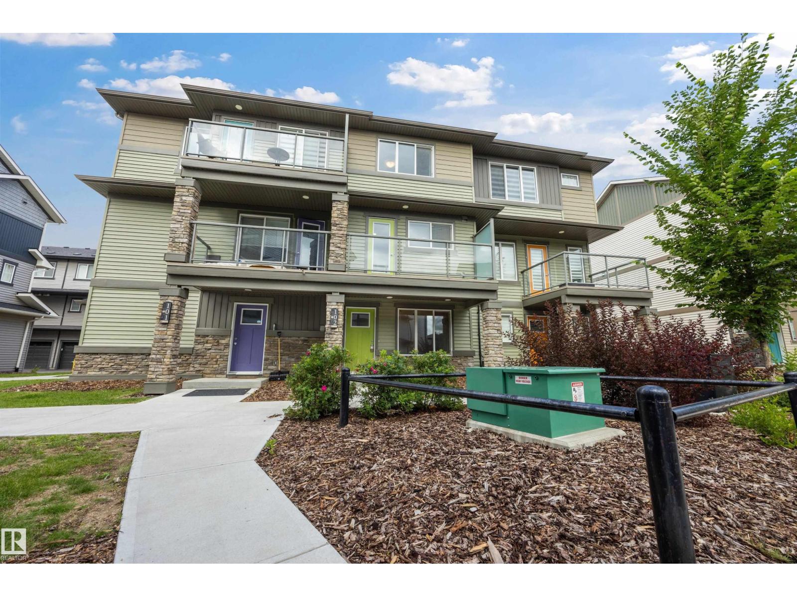 #102 1530 TAMARACK BV NW Property Photo 1