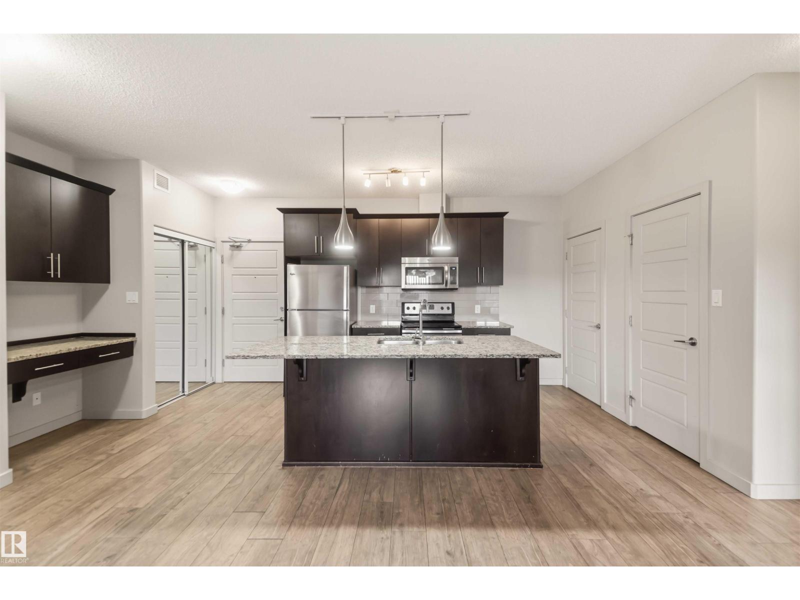 #414 5510 SCHONSEE DR NW Property Photo 1