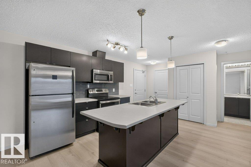 #103 508 ALBANY WY NW Property Photo 1