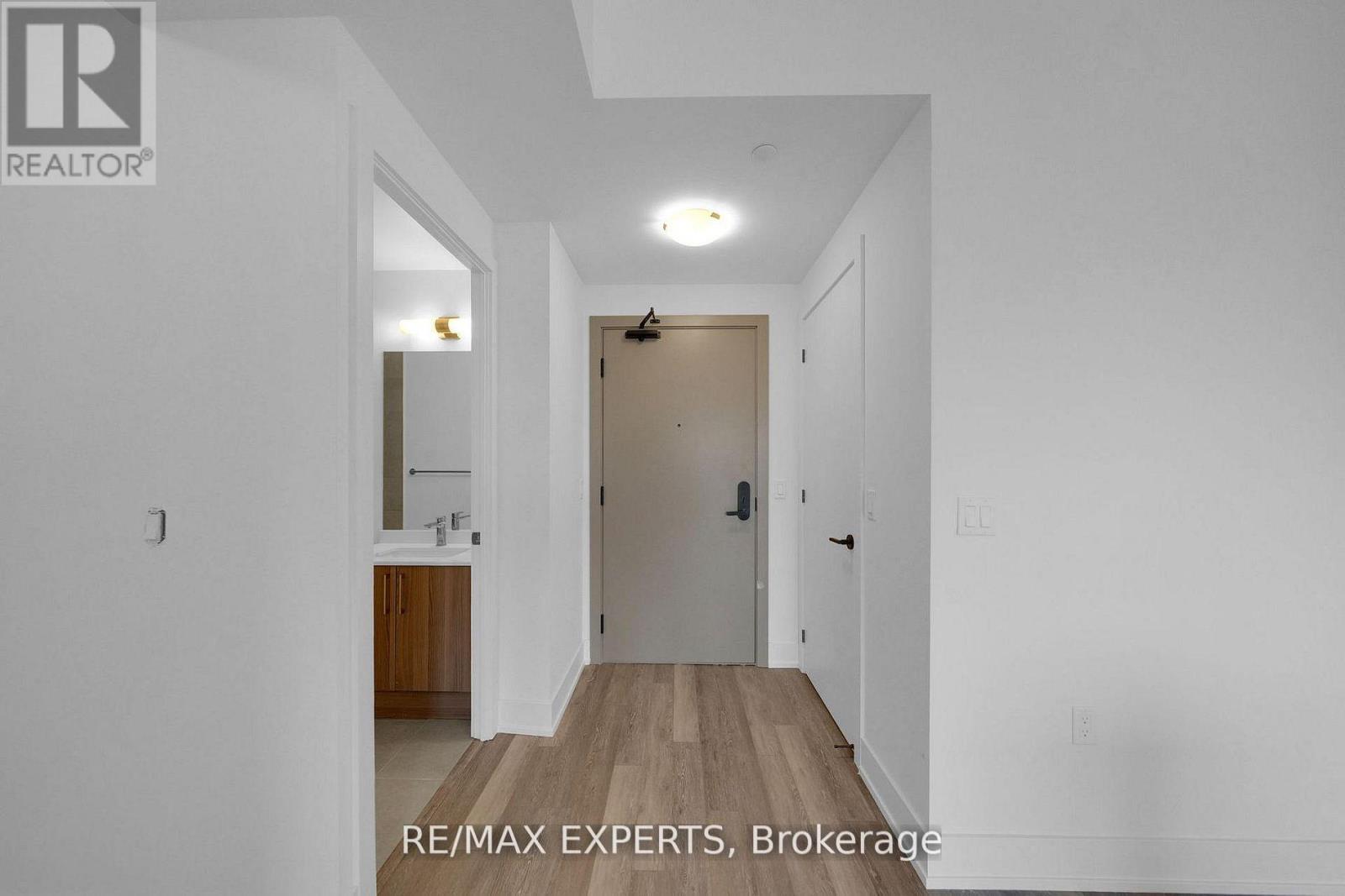 203 - 2075 King Road Property Photo 2