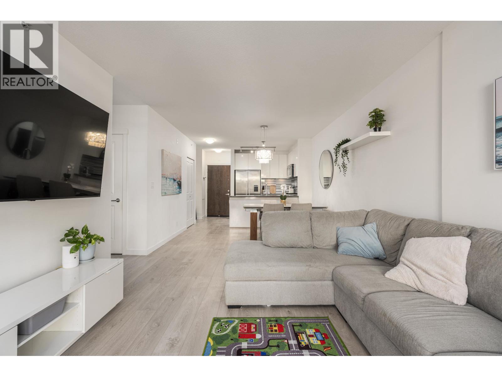210 3168 RIVERWALK AVENUE Property Photo 1