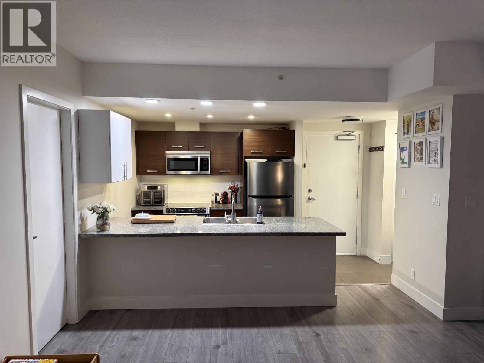 207 2957 GLEN DRIVE Property Photo 1