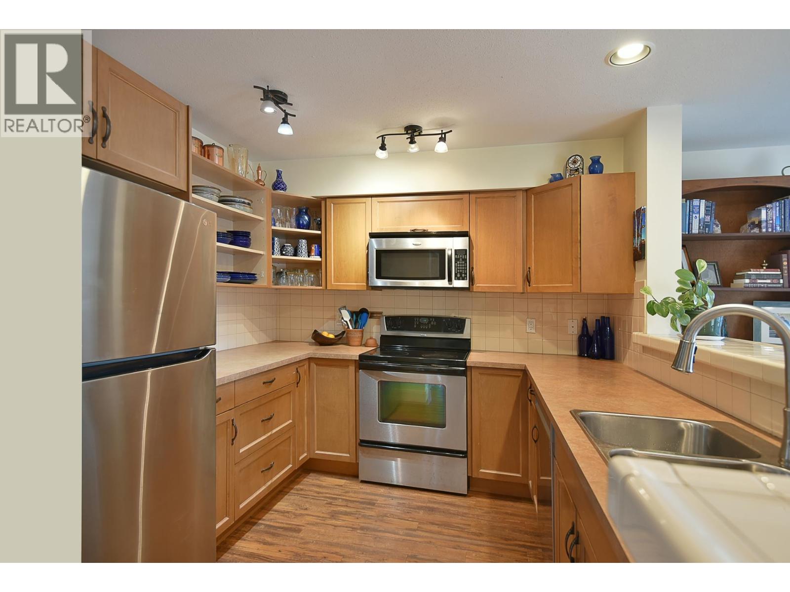 303 5711 Ebbtide Street Property Photo 1