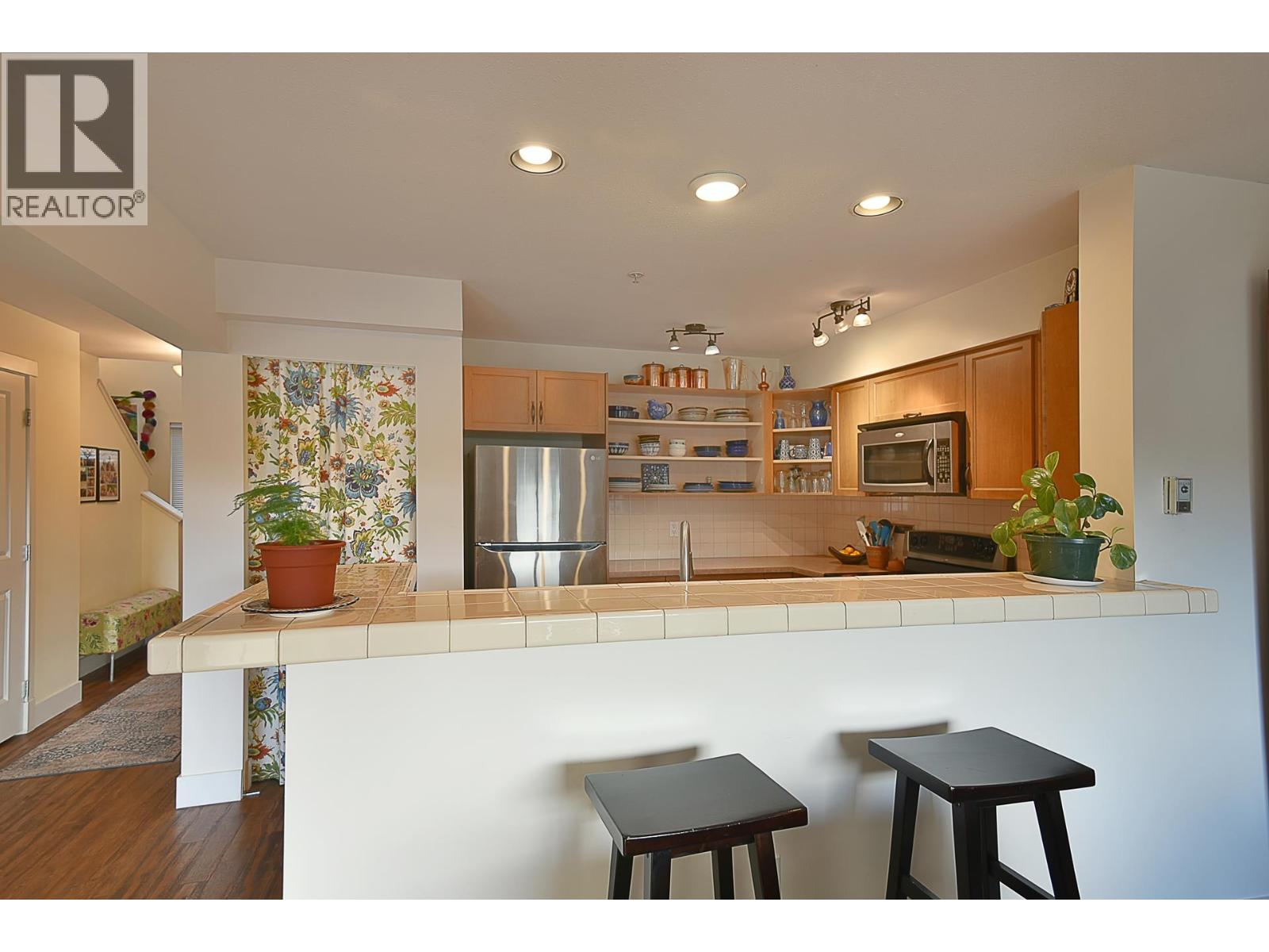 303 5711 Ebbtide Street Property Photo 4