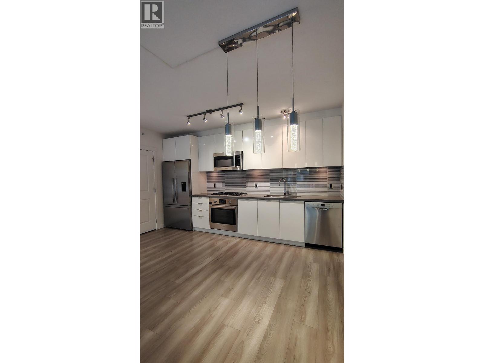 101 3168 RIVERWALK AVENUE Property Photo 1