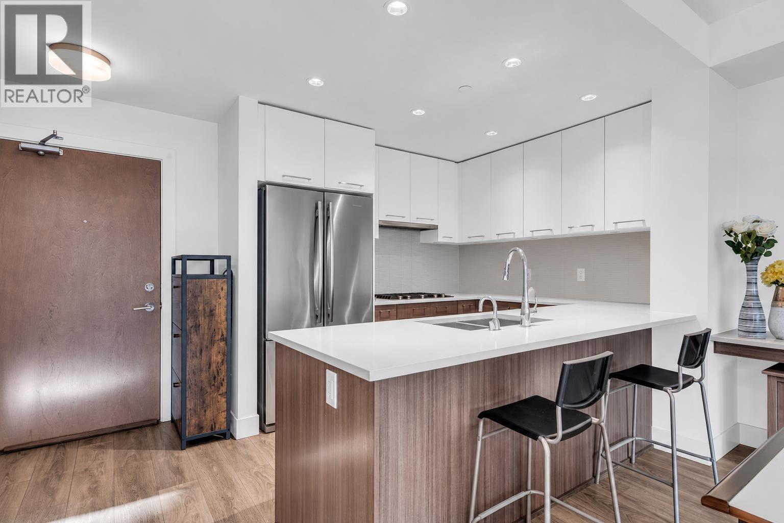 307 8580 RIVER DISTRICT CROSSING Property Photo 1