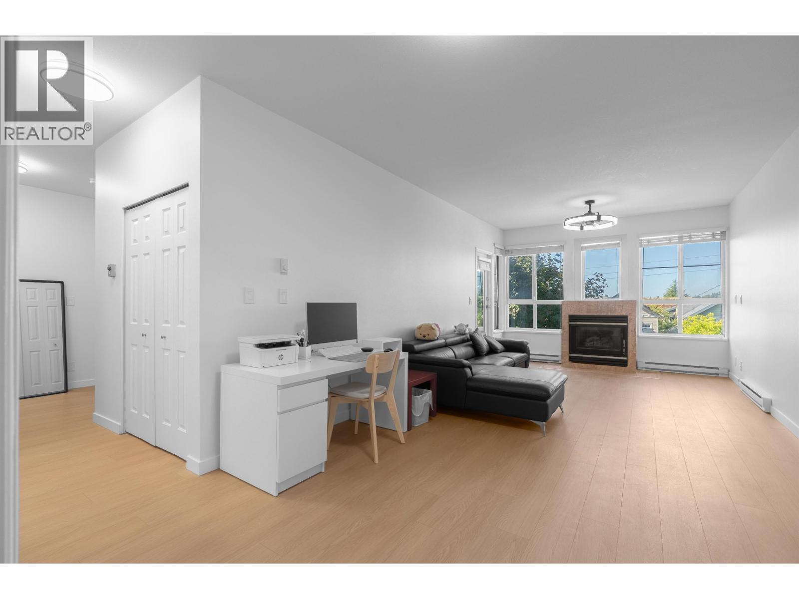 202 7300 Gilbert Road Property Photo 1