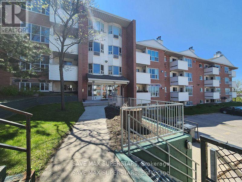 205 - 120 BELL FARM ROAD E Property Photo 1
