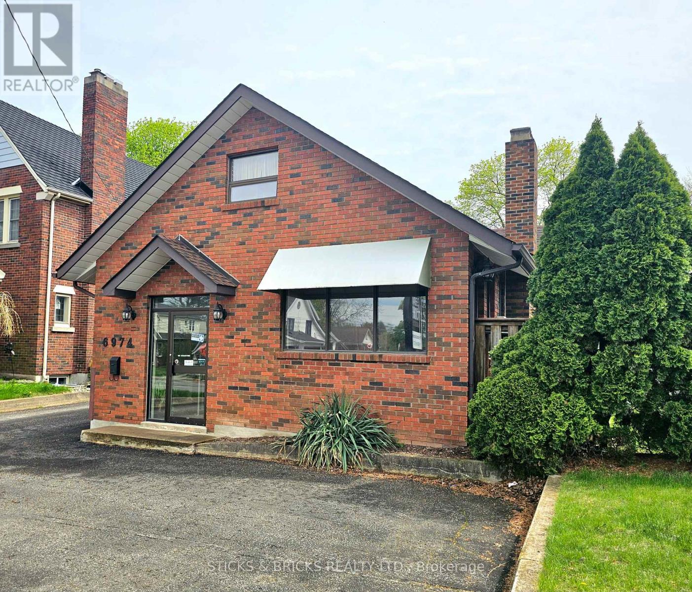 6974 LUNDYS LANE Property Photo 1