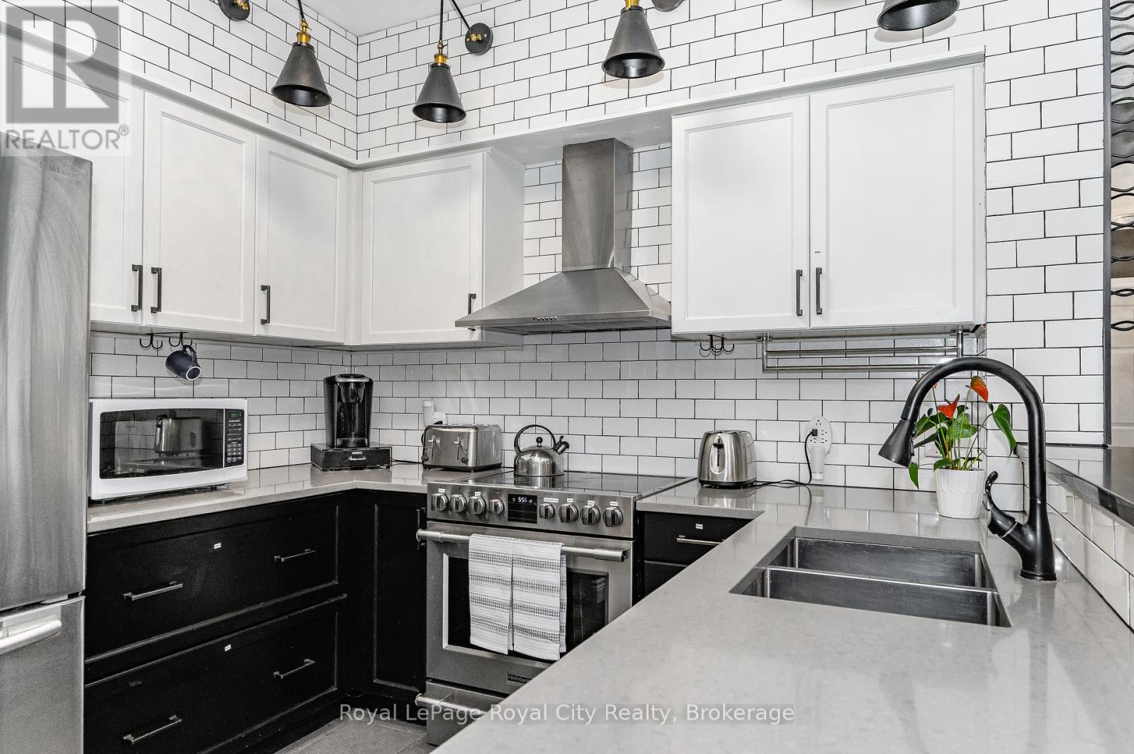 102 - 308 WATSON PARKWAY N Property Photo 1