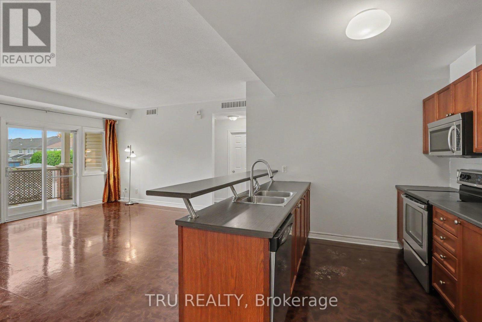 7 - 165 Waterbridge Drive Property Photo 8