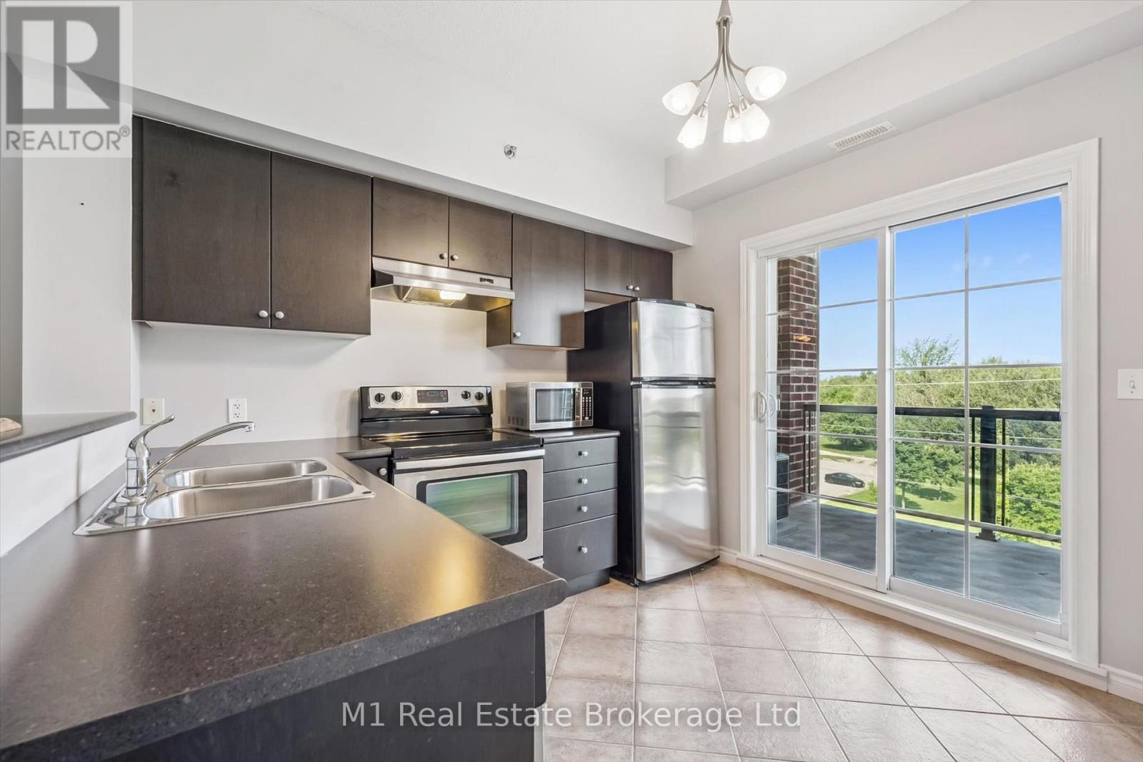 412 - 308 Watson Parkway N Property Photo 1