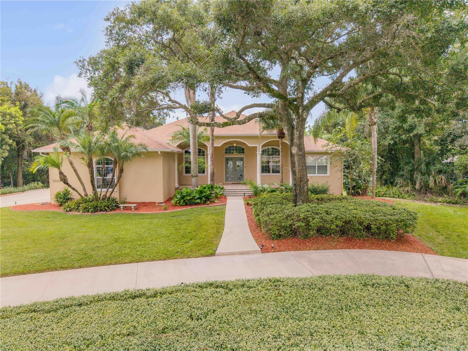 5842 Spruce Creek Woods Dr Property Photo 1