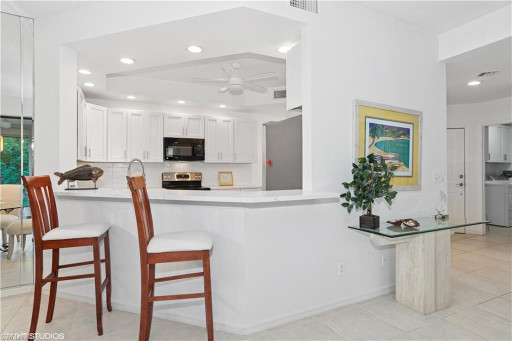 7048 Pelican Bay Blvd C-105 Property Photo 6