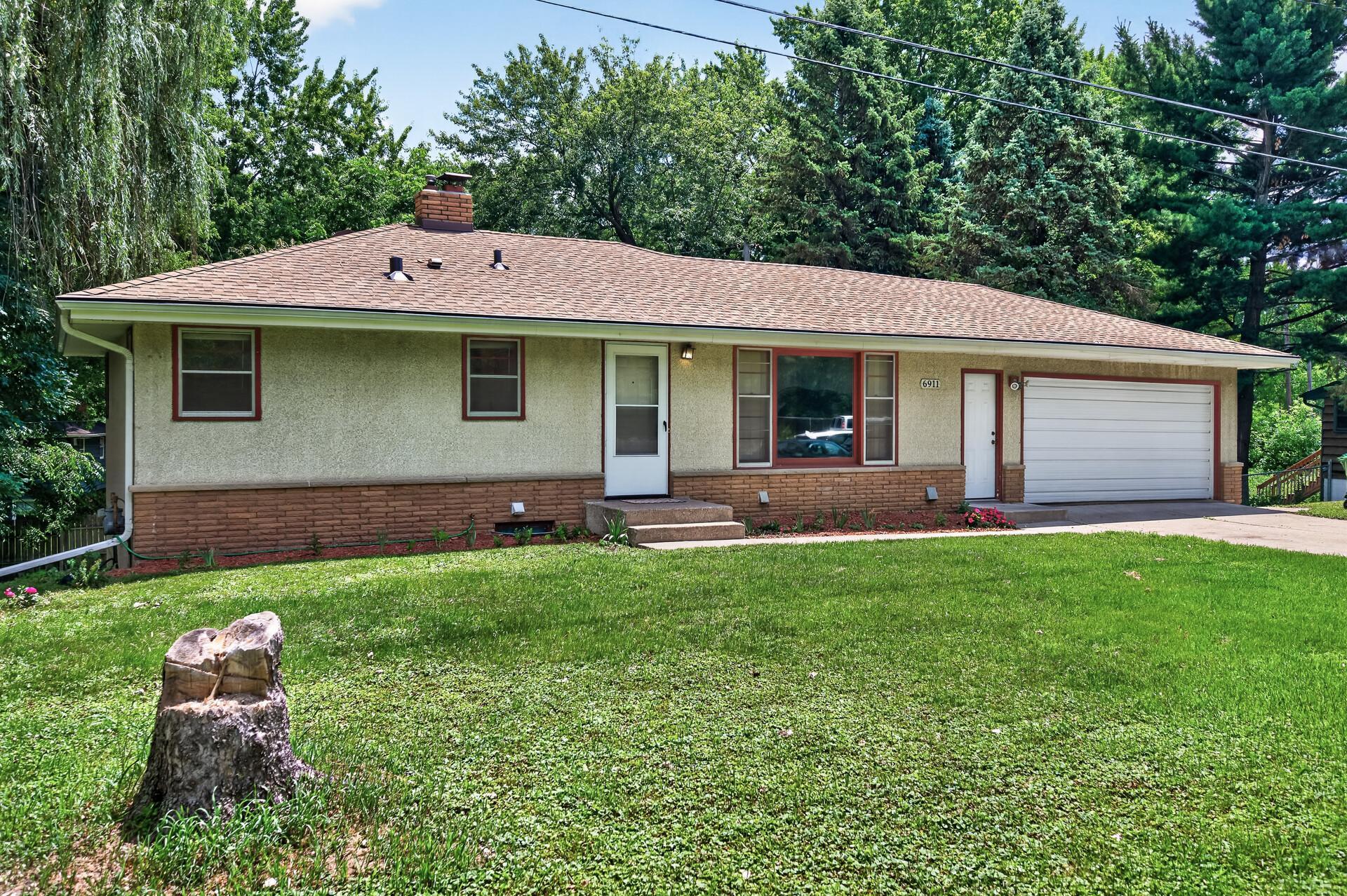 6911 E River Road Ne Property Photo 1